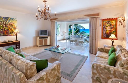 Schooner Bay Apartment | Schooner bay is a beachfront condominium with a freeform swimming pool as the focal point