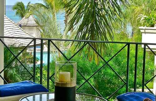 Schooner Bay Apartment | Schooner bay is a beachfront condominium with a freeform swimming pool as the focal point