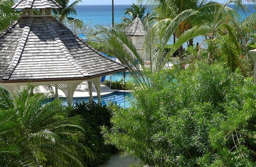 Schooner Bay Apartment | Schooner bay is a beachfront condominium with a freeform swimming pool as the focal point