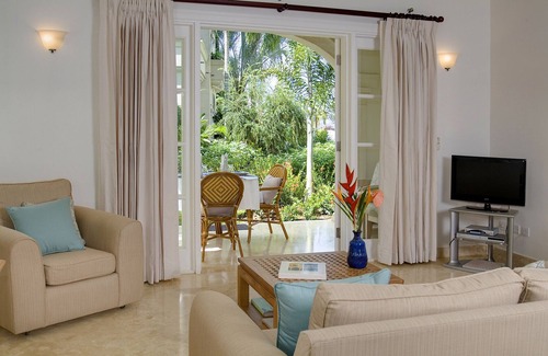 Schooner Bay Apartment | Schooner bay is a beachfront condominium with a freeform swimming pool as the focal point