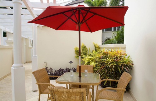 Schooner Bay Apartment | Schooner bay is a beachfront condominium with a freeform swimming pool as the focal point
