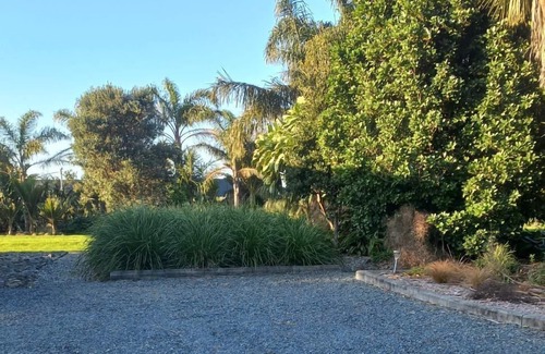 Waipu Apartment | Sea and rural views from your private deck, surrounded by tropical gardens