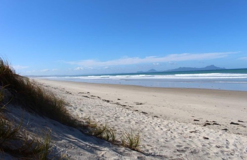 Waipu Apartment | Sea and rural views from your private deck, surrounded by tropical gardens