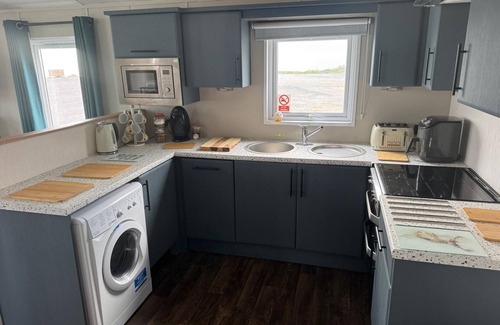 Porthcawl Cabin | Sea Front 2 Bedroom Lodge (Honeysuckle 95) at Trecco Bay Holiday Park, Porthcawl