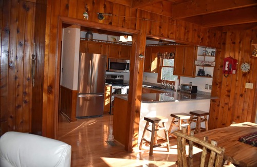 Yadkin Valley Cabin | Secluded Cabin on a mountain stream with water views from all rooms