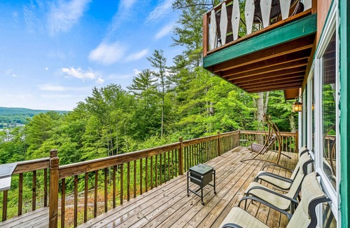 Brant Lake House | Secluded cabin with dock, wraparound deck, gorgeous view & enclosed porch