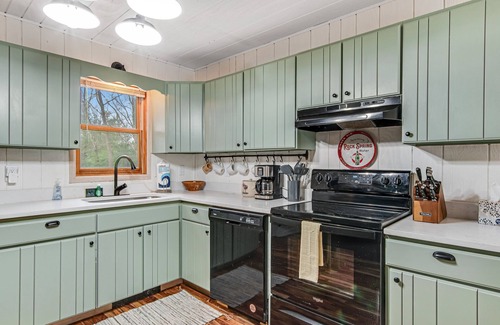 Oxford House | Secluded home near the lake with huge sunroom, firepit, gas grill, & private W/D