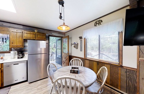 Murphy House | Secluded home with deck, firepit, sunroom, gas fireplace, & W/D