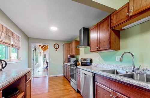 Cleveland House | Secluded mountain-view hideaway with pond, firepit, large yard, fireplace & AC