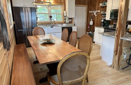 Fairhope Cabin | Secluded waterfront fishing cabin, boat dock, pier, sunsets, boat to beach