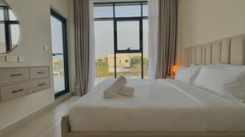 Dubai Villa | Serene Green Escape and Stunning Views in DAMAC Hills 1 by Bhavan Vacation Homes