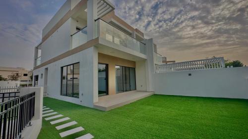 Dubai Villa | Serene Green Escape and Stunning Views in DAMAC Hills 1 by Bhavan Vacation Homes