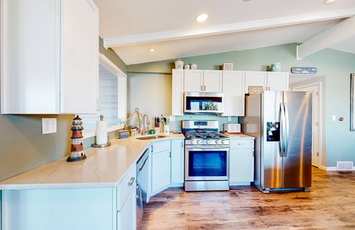 Three Lakes House | Serene lakefront retreat with wet bar, wraparound decks, dock, fireplaces, AC