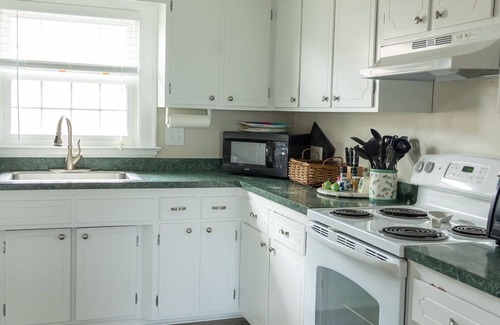 Virginia Beach House | Shore Beats Work - Enjoy the ocean breeze from the screened porch