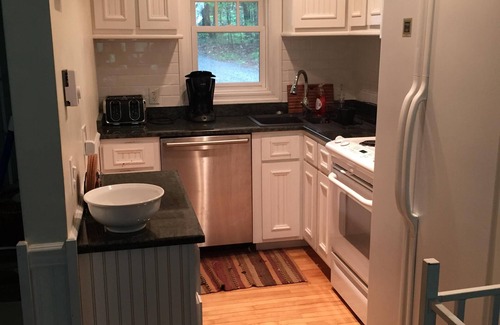 Lake Placid Club House | Short walk to village.with private wooded setting. EV Charger in parking area.