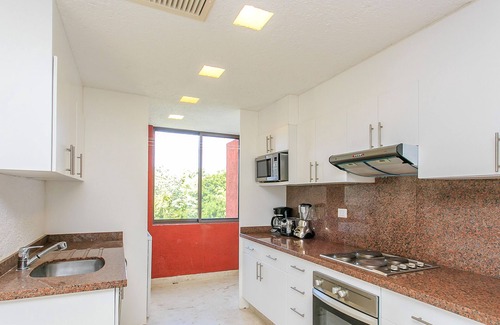 Playacar Fase II Condo | Sian Kaan by Stella Rentals