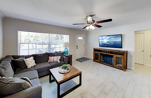 Harbor Bluffs House | Single-story home with outdoor dining, firepit, home office & laundry room