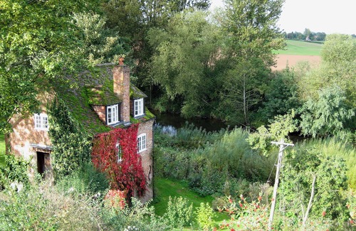 Clows Top Cottage | Situated by the banks of a river with private fishing just yards away.