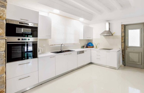 Drosia House | Situated within lush, beautifully maintained gardens, this renovated stone built property is a stunn