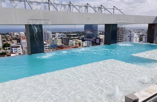 Evaristo Morales Apartment | Skyline Luxury APT 1bedroom KING size bed in Downtown Sto Dgo Rooftop POOL/GYM