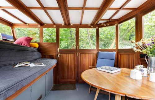 Angel Boat Rental | Slash Arts houseboat on secluded mooring in central London