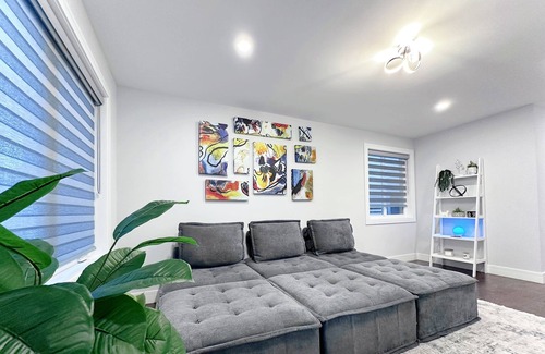 Irving Park Apartment | Sleek 3BR: Minimalist Style, Fire Pit, 65-inch TV, & Tech-Ready!