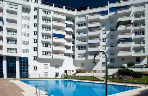 Nueva Andalucia Apartment | Sleeps 8 adults + 2 children Aircon TV Swimming pool WiFi Underground parking