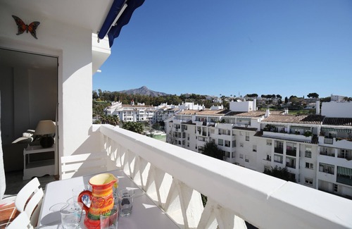 Nueva Andalucia Apartment | Sleeps 8 adults + 2 children Aircon TV Swimming pool WiFi Underground parking