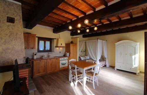 Castel Focognano Villa | Small stone house with panoramic terrace and splendid view over the green woods of the Casentino val