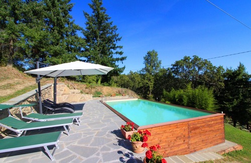 Castel Focognano Villa | Small stone house with panoramic terrace and splendid view over the green woods of the Casentino val