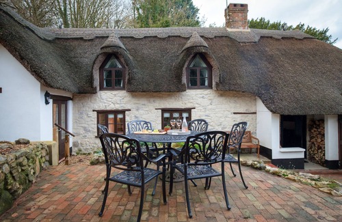 Chard Cottage | Smithycroft is a beautiful thatched and stone detached cottage.
