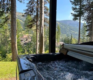 Whitefish House | Snow Ghost Den True Ski in Ski out sleeps 9 people 3 Bed 2 and a half bathrooms Home with private hot tub