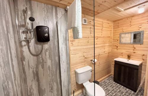 Llanybri Ski Chalet | Snug hut 5-Hot Tub-Woodland Lodges-Pembrokshire-Tenby