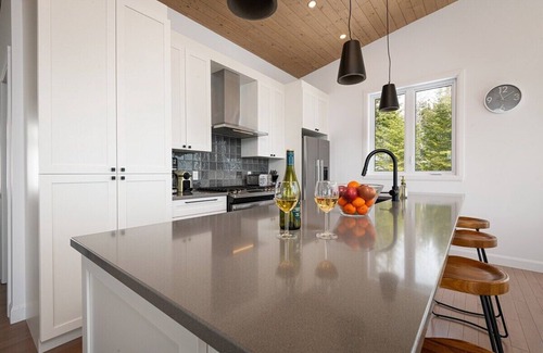 Les Eboulements Ski Chalet | Solstice 203: Luxury Living, Riverfront Serenity
