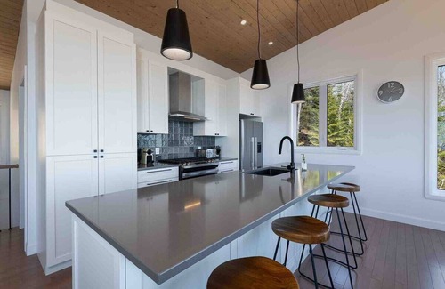 Les Eboulements Ski Chalet | Solstice 203: Luxury Living, Riverfront Serenity