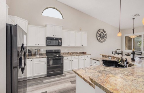 Rovey Farm Estates House | Spa like home, walk to the stadiums, with a private heated pool & newly updated!