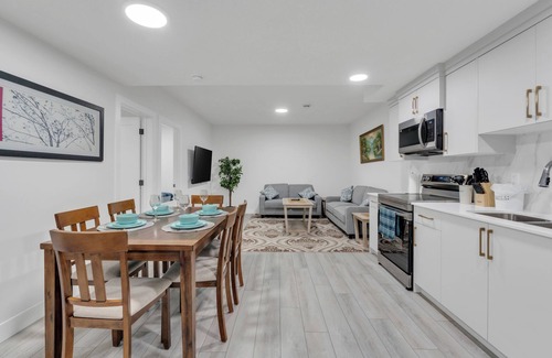 Calgary House | Spacious 2-Bedroom Legal Basement Suite | Private Entrance | 15 Mins to Airport