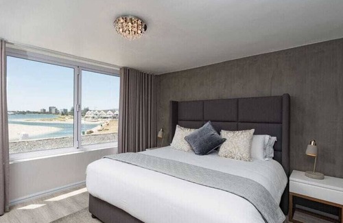 Lagoon Beach Apartment | Spacious 2 Bedroom, Panoramic Sea Views with Wifi and Parking