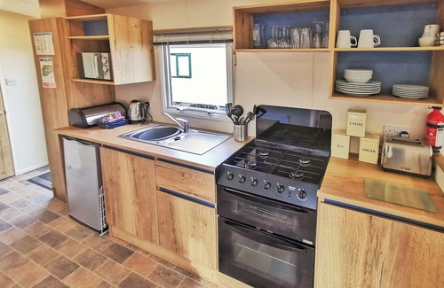 Ludchurch House | Spacious and well-presented 12ft-wide caravan with one double and one twin.
