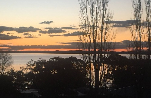Soldiers Point House | Spacious covered balcony overlooking Sunset beach. Large garden and water views