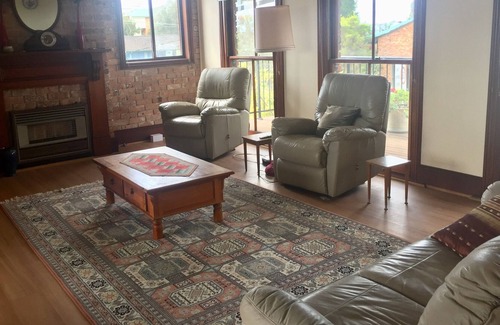 Soldiers Point House | Spacious covered balcony overlooking Sunset beach. Large garden and water views