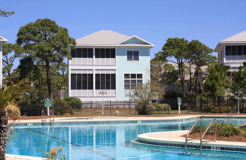Plantation House | Spacious dog-friendly home with elevator, screened decks, on-site pool, & gym