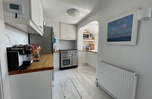 Cawsand House | Spacious light cosy beach front house with balcony overlooking the sea