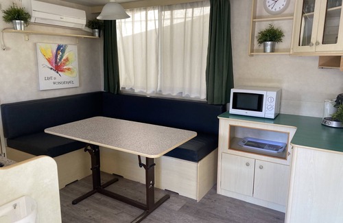 Viareggio Ski Chalet | Spacious mobile home, with veranda, on the family camping Paradiso