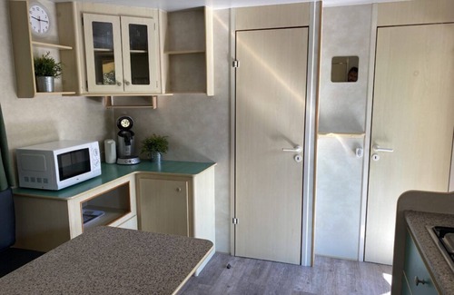Viareggio Ski Chalet | Spacious mobile home, with veranda, on the family camping Paradiso