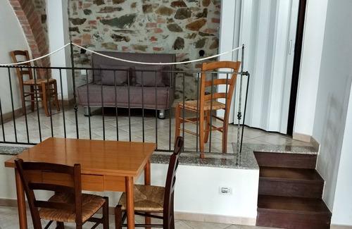 Grosseto Other | Spacious one-bedroom apartment with large bedroom, porch over entrance and pool