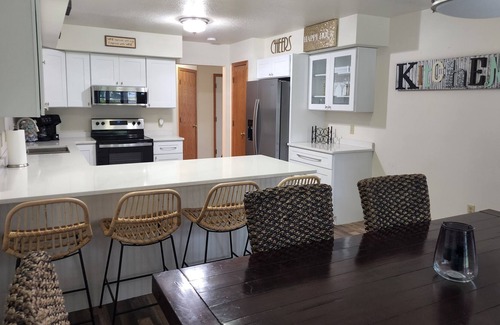 Tomah House | Spacious Townhome in quiet neighborhood with firepit!