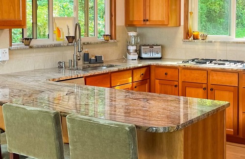 Kingston House | Spacious waterfront retreat with inviting deck, fireplace & games