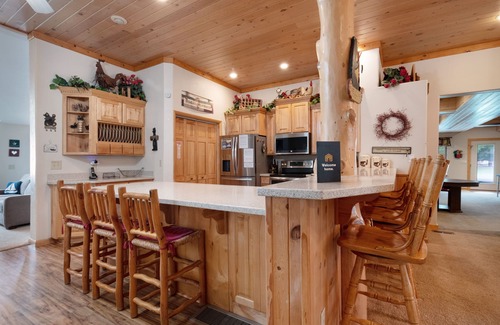 Garden City House | Spacious Waterfront Getaway with Private Hot Tub, Furnished Deck, and Game Room