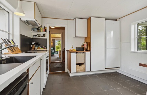 Vejlby Fed House | Spend a wonderful vacation in this comfortable cottage overlooking the sea from the property.